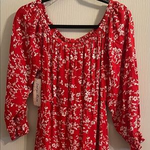 Long flowing red boho/modern style dress.